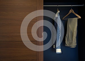 Clothes in wardrobe wood