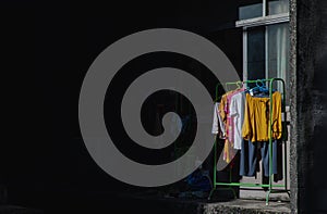 Clothes washed and Hanging drying clothes on the iron clothes rack outside the room apartment window