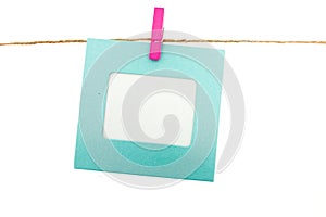 Clothespin and frame card hanging on rope