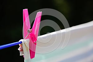 Clothespin holding laundry on the drying line