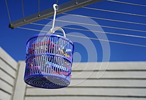 Clothespins in a basket, hang the laundry outside