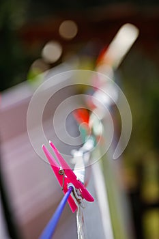 Clothespins holding laundry on the drying line