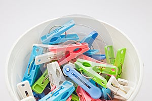 Clothespins in plastic bucket