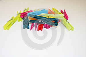 Clothespins on a white background decompose