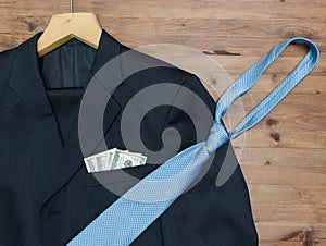 Clothing concept. jacket and hanger. tie dollars