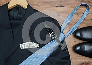Clothing concept. jacket hanger. tie dollars Watch