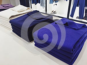 Clothing on display in a boutique store in shopping mall, fast fashion
