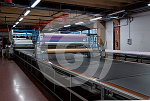 Clothing factory - Automatically cutting textile photo