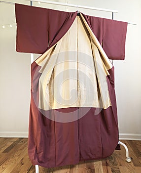 Clothing hanger with cloth and fabric in a dressing room.