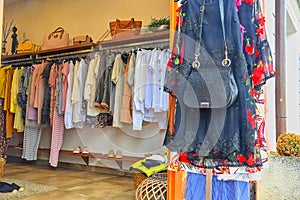 Clothing on hanger at the modern shop boutique photo