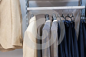 Clothing on hangers at the boutique.