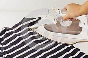 Clothing beside iron prepared for Ironing