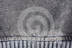 clothing items stonewashed cotton fabric texture with seams, clasps, buttons and rivets, macro