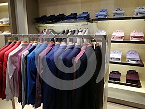 Clothing for men in a shop - colorful blazers