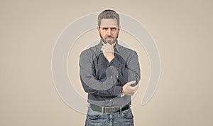 Clothing for the serious man. Bearded man think grey background. Serious look. Chin propping