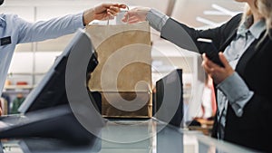 Clothing Store Checkout Cashier Counter: Beautiful Young Woman Buys Blouse from Friendly Retail