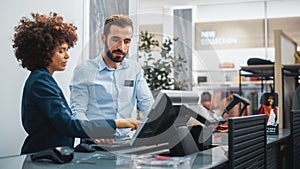 Clothing Store Checkout Cashier Counter: Female Retail Sales Manager Explaining to New Male