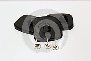 Cloting security tags with pins on the white background
