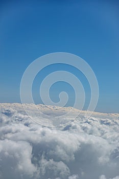 Cloud below and blue sky beyond horizon for background use