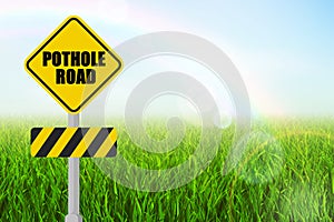 pothole Road sign board.