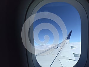 Cloud with blue sky from the airplane window