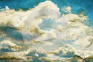 Cloud and blue sky on crumpled paper texture