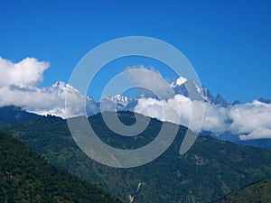 Cloud capped mount Kangchenjunga or Kanchenjunga observable from Sikkim India photo