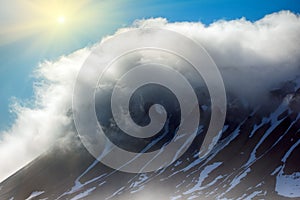 Cloud caught on the glacial sheet, nunatak in fog