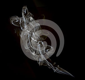 A cloud of cigarette smoke on a black background