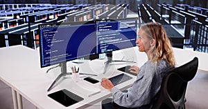 Cloud Computer Engineer Coding In Server Room In Data Center