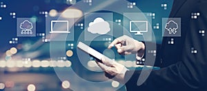 Cloud computing with businessman using a tablet