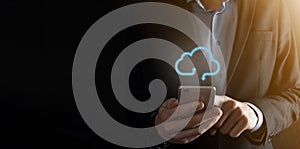 Cloud computing concept - connect smart phone to cloud. Businessman or information technologist with cloud computing icon and
