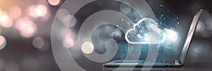 Cloud computing concept with laptop and digital clouds