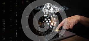 Cloud Computing Concept. A man uses laptop computer to upload and download IT resources via cloud technology