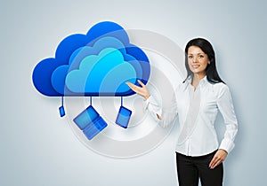 Cloud computing idea concept. Businesswoman points to the cloud