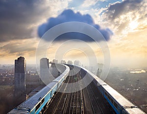 cloud computing with a speeding train on a city background