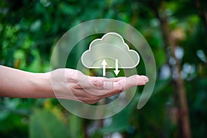 Cloud computing technology concept. Hand holding cloud icon on nature background. t