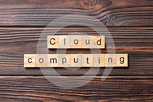 Cloud computing word written on wood block. Cloud computing text on cement table for your desing, concept