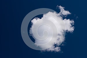 Small cloudlet on a dark blue sky photo