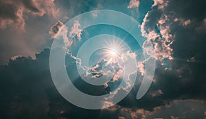 Cloud-filled sky, with a bright beam of sunlight breaking through the clouds