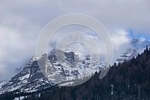 Cloud and fog shrouded mountains in winter