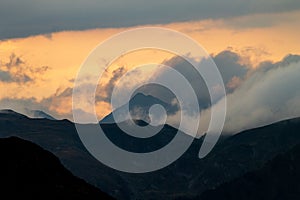 Cloud Formation Surrounds the Mountains at Sunset