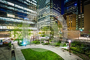 Cloud Gardens Park and modern buildings in the Financial District at night, in Toronto, Ontario.