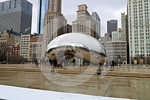 Cloud gate at Chicago Illinois Bean mirror art with people and buildings mirrored tourist landmark at this mayor USA city.