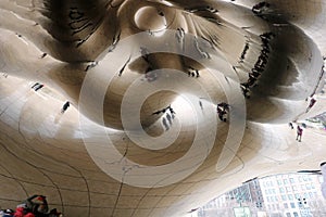 Cloud gate at Chicago Illinois Bean mirror art with people and buildings mirrored tourist landmark at this mayor USA city.