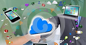 Cloud icon, electronic devices and digital icons against businessman and businesswoman shaking hands