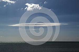 Cloud of interesting shape against the blue sky