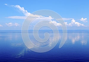 Cloud like plane over water surface, lake baikal