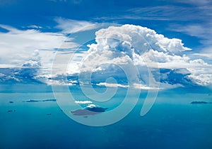 Cloud and ocean with island, aerial view