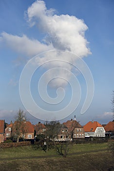 Cloud over colorful houses in Fredericia